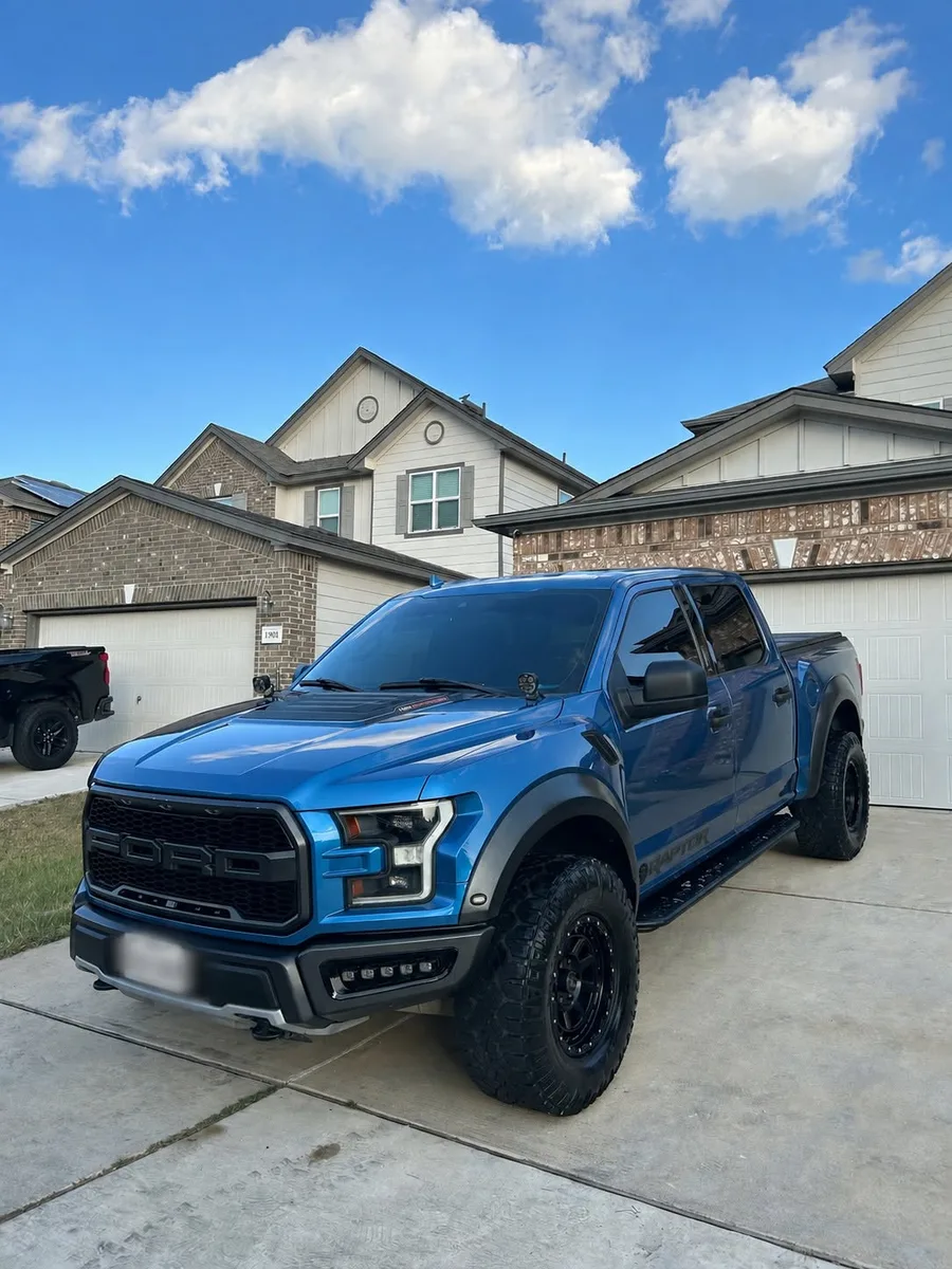 Clean blue Ford truck after exterior detailing