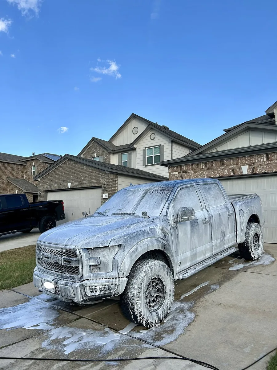 Pickup truck covered in foam during an exterior wash